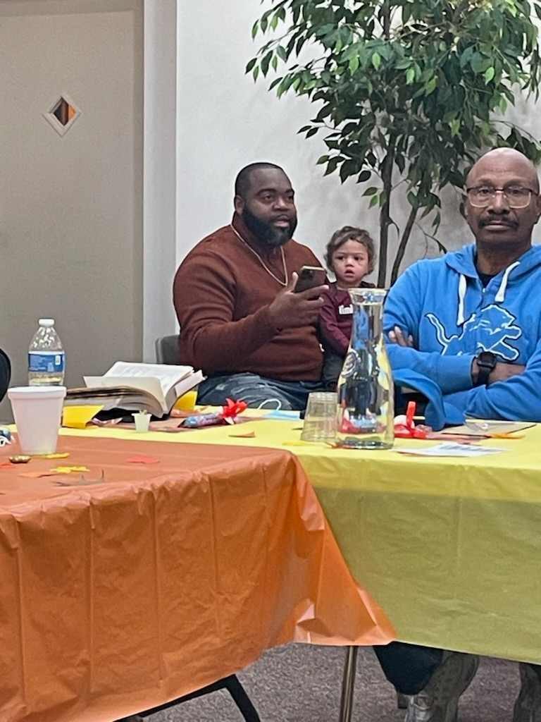 Men in conversation at the breakfast table